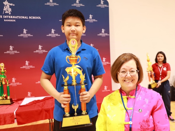 Boy with trophy at the King's Bangkok Chess Championship