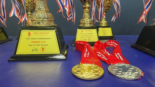 Medals and trophies at chess tournament.