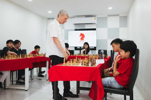 Lazirev, Chess Grandmaster playing simul event in Bangkok with Red Knight Chess Club team.