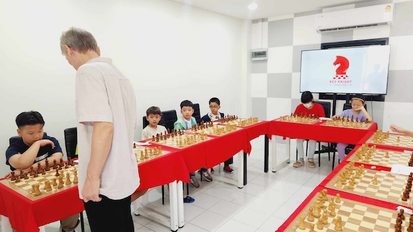 Grandmaster Vladimir Lazarev joins Riste at Red Knight Chess Club for a simul event with chilidren.