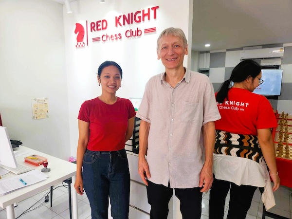 Grandmaster Vladimir Lazarev joins Riste's wife at Red Knight Chess Club.